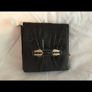 Judith Leiber black clutch